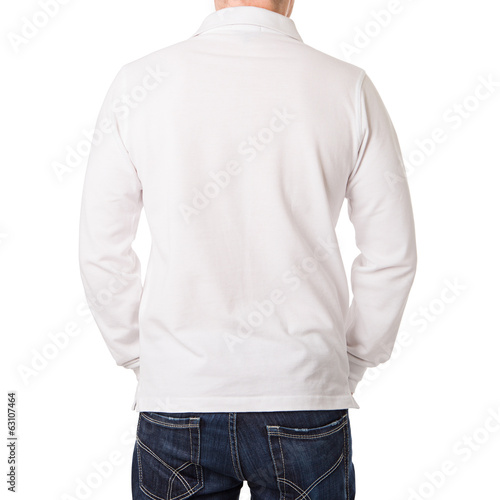 Photo: White polo shirt with a long sleeve on a young man White polo shirt with a long sleeve on a young man