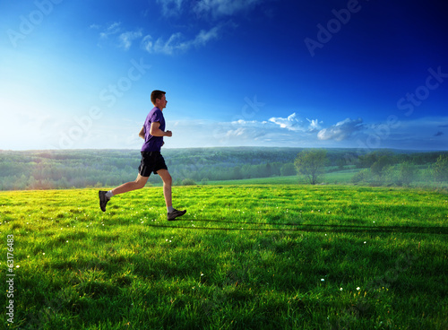 Photo: sunset and running young man sunset and running young man