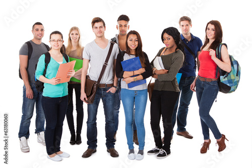 Photo: Confident University Students Walking Over White Background Confident University Students Walking Over White Background