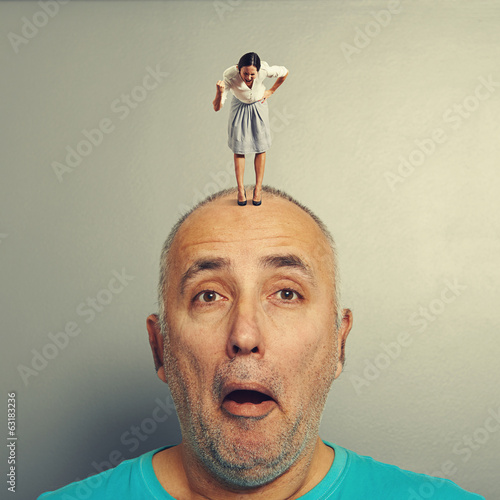 Photo: man with angry wife on his head man with angry wife on his head