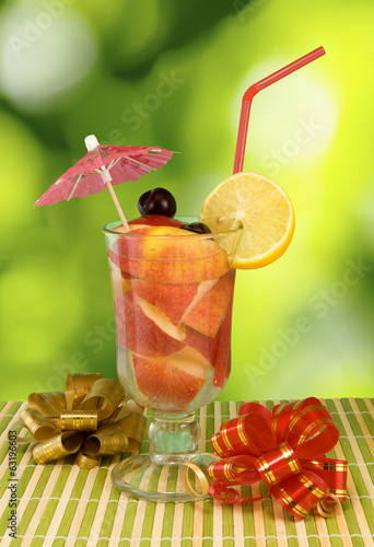 Photo: image of cocktail on green background image of cocktail on green background
