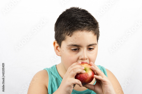 Photo: The Boy Is Eating Apple The Boy Is Eating Apple