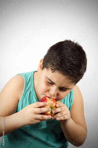 Photo: The Boy Is Eating Apple The Boy Is Eating Apple