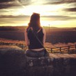 girl enjoying sunset sitting on wall in yorkshire girl enjoying sunset sitting on wall in yorkshire