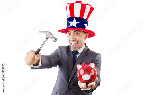Photo: Man breaking the bank with hammer on white Man breaking the bank with hammer on white