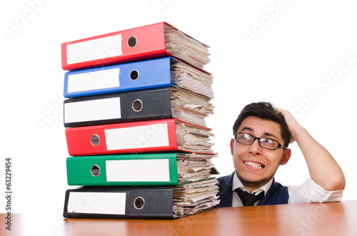 Photo: Funny man with lots of folders on white Funny man with lots of folders on white