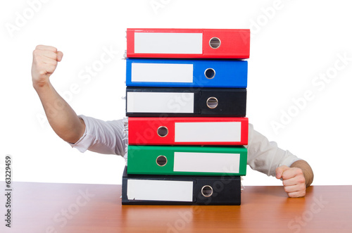 Photo: Funny man with lots of folders on white Funny man with lots of folders on white
