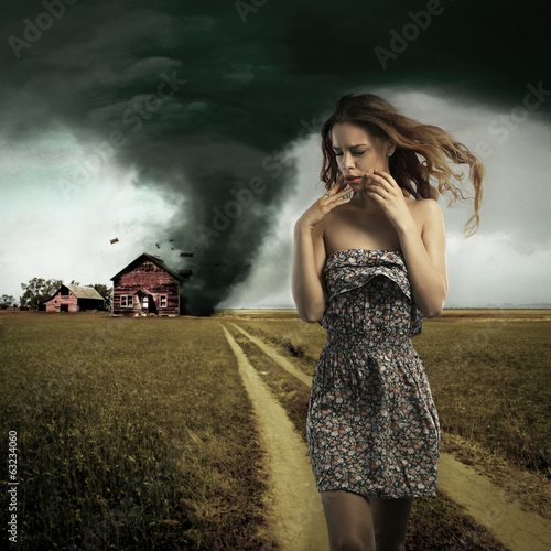 Photo: Tornado destroying a woman's house Tornado destroying a woman's house
