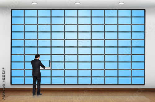 Photo: man puts plasma panel man puts plasma panel