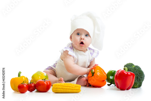 Photo: funny baby cook with healthy food vegetables funny baby cook with healthy food vegetables