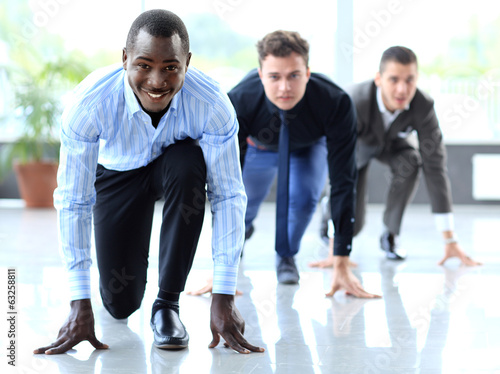 Photo: Competitive businessmen ready to start running Competitive businessmen ready to start running