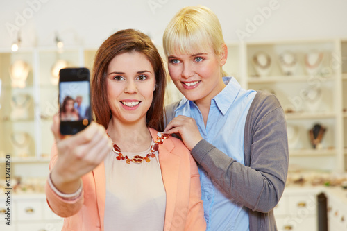Photo: Women taking selfie while shopping Women taking selfie while shopping