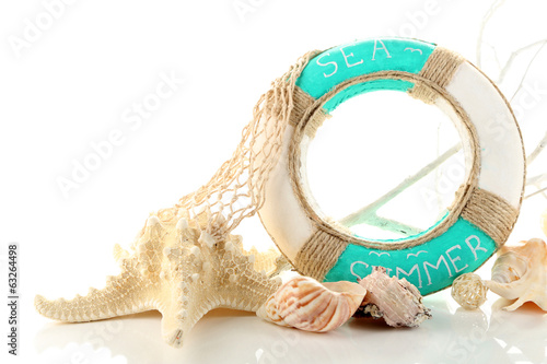 Photo: Lifebuoy and sea shells, isolated on white Lifebuoy and sea shells, isolated on white