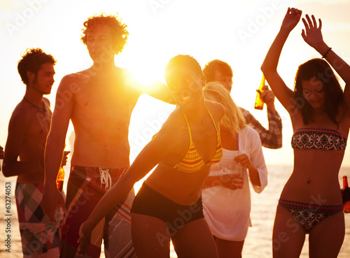 Photo: Young People Enjoying a Summer Beach Party Young People Enjoying a Summer Beach Party