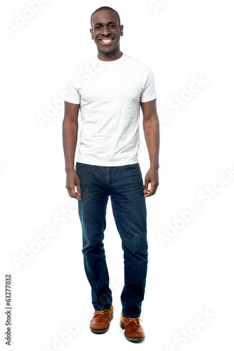 Photo: Young smiling guy in casual attire Young smiling guy in casual attire