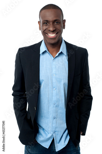 Photo: Businessman posing with hands in pocket Businessman posing with hands in pocket
