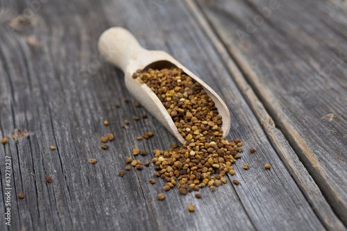 Photo: Healthy bee pollen on background Healthy bee pollen on background