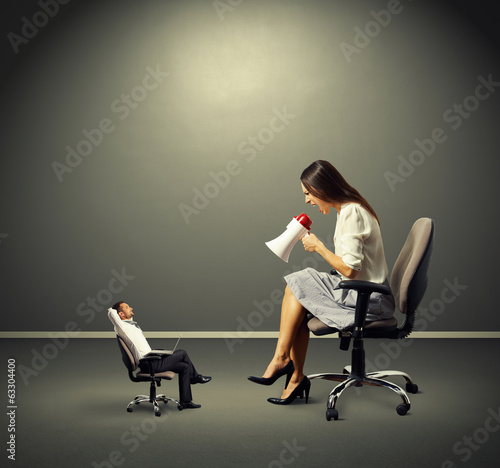 Photo: smiley man listening angry woman smiley man listening angry woman