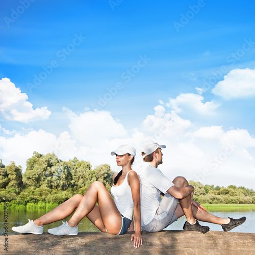 Photo: Young couple relaxing outdoors Young couple relaxing outdoors