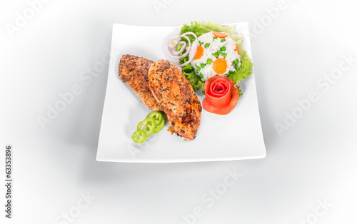 Photo: Grilled steak on plate isolated on white Grilled steak on plate isolated on white