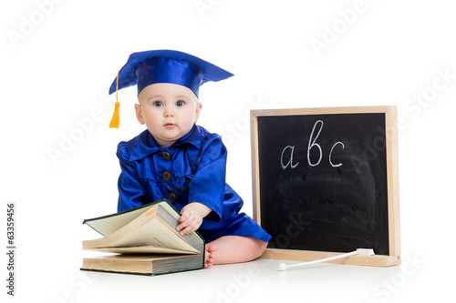 Photo: Baby in academician clothes with book and chalkboard Baby in academician clothes with book and chalkboard