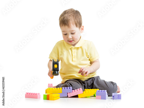 Photo: child playing with block toys child playing with block toys