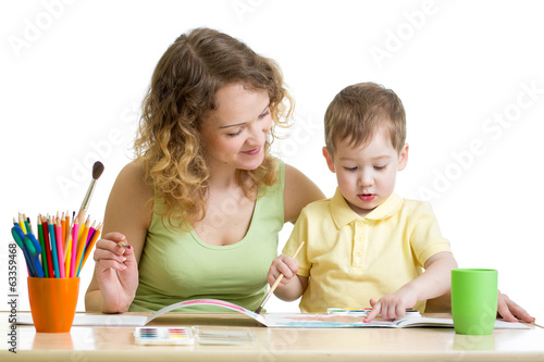 Photo: mother and kid boy paint together mother and kid boy paint together