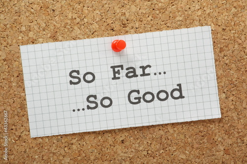 Photo: The phrase So Far, So Good on a cork notice board The phrase So Far, So Good on a cork notice board