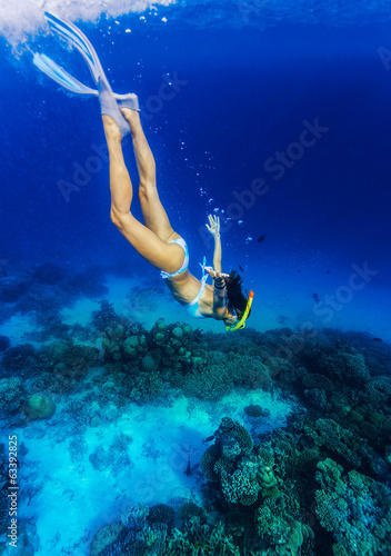 Photo: Woman diving to the sea bottom Woman diving to the sea bottom