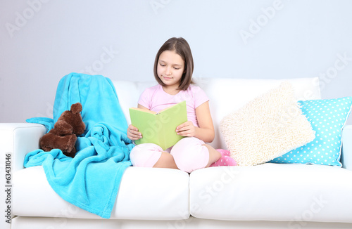 Photo: Beautiful little girl sitting Beautiful little girl sitting