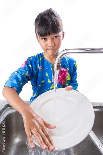 Photo: Young Girl Washing Dishes Young Girl Washing Dishes