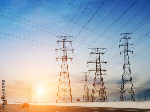 Photo: High-voltage tower sky background,besides the highway. High-voltage tower sky background,besides the highway.