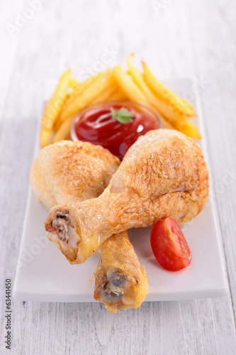 Photo: grilled chicken legs and fries grilled chicken legs and fries