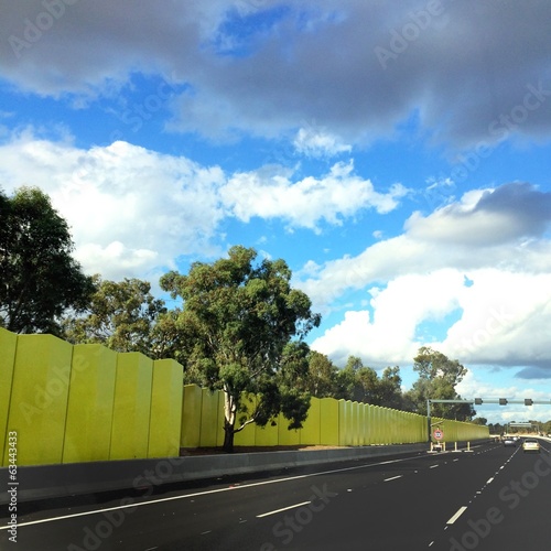 Instant Collection: bright green wall next to highway bright green wall next to highway