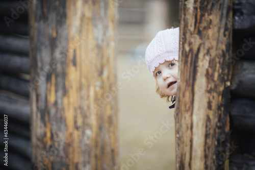 Photo: Little girl in Spring outdoors Little girl in Spring outdoors