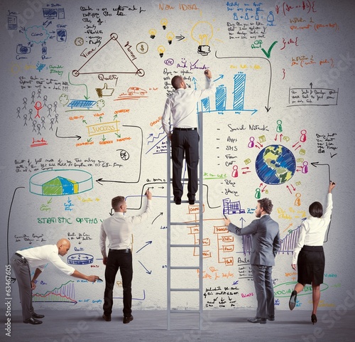 Photo: Business team drawing a new project Business team drawing a new project
