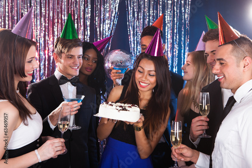 Photo: Beautiful young woman celebrating birthday Beautiful young woman celebrating birthday