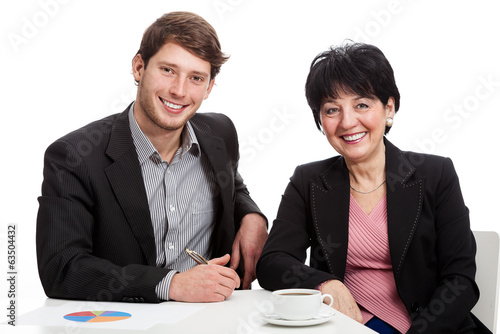 Photo: Smiling coworkers during job Smiling coworkers during job