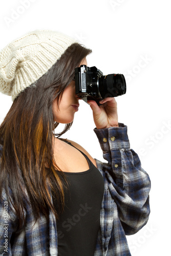 Photo: Young woman with brown hair holds camera Young woman with brown hair holds camera