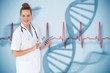 Composite image of pretty nurse using tablet pc Composite image of pretty nurse using tablet pc