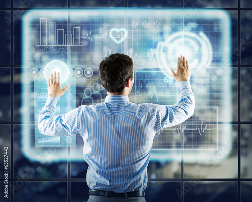 Photo: businessman working with virtual technologies businessman working with virtual technologies