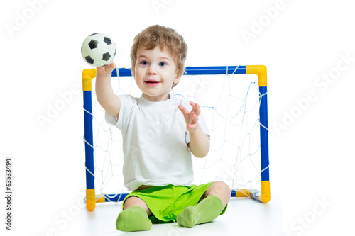 Photo: kid football player holding soccer ball kid football player holding soccer ball