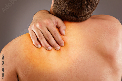 Photo: Young man with neck pain Young man with neck pain