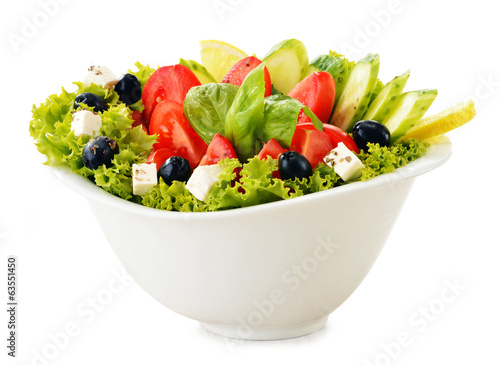 Photo: Vegetable salad bowl isolated on white Vegetable salad bowl isolated on white