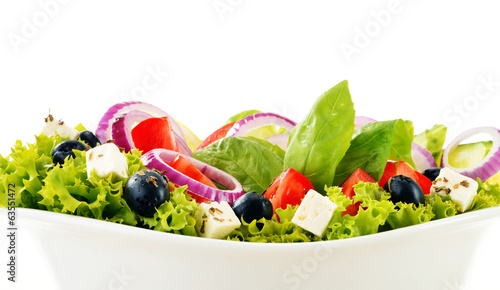 Photo: Vegetable salad bowl isolated on white Vegetable salad bowl isolated on white