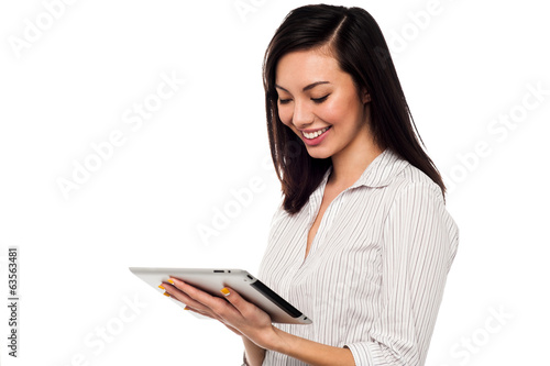 Photo: Business lady using tablet pc device Business lady using tablet pc device