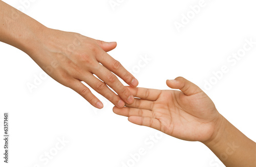 Photo: Reaching a hand. Close-up of human hands trying to reach each ot Reaching a hand. Close-up of human hands trying to reach each ot
