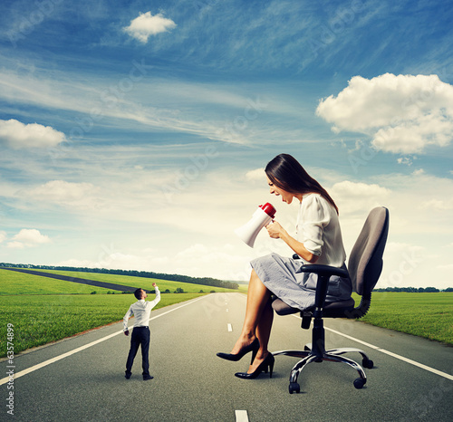 Photo: businessman and big screaming woman businessman and big screaming woman