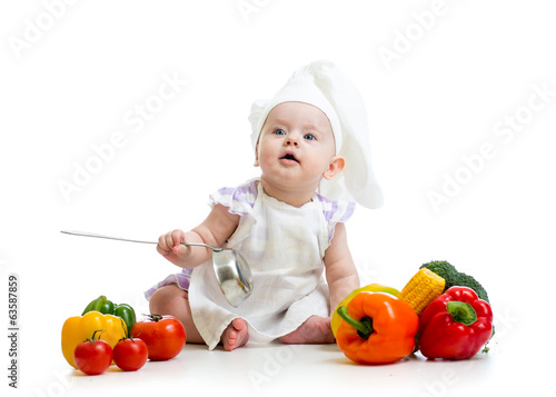 Photo: funny baby cook with vegetables funny baby cook with vegetables