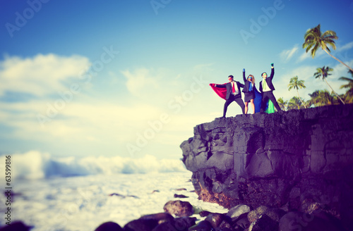 Photo: Business superheroes edge of cliff Business superheroes edge of cliff